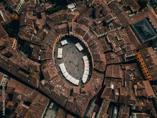 Landmarks of Tuscany, Italy - Piazza dell'Anfiteatro - The Famous Amphitheater Square in Lucca city. Aerial view landscape. Tuscany. Italy. View from above. Drone Image