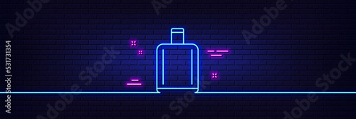 Neon light glow effect. Airport baggage reclaim line icon. Airplane luggage sign. Flight checked bag symbol. 3d line neon glow icon. Brick wall banner. Baggage reclaim outline. Vector