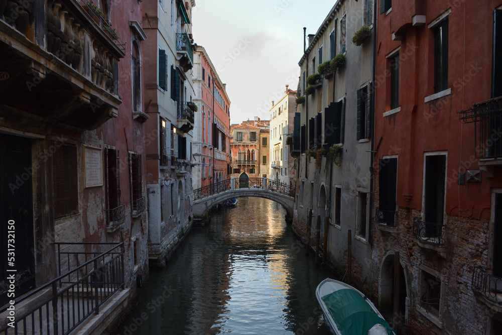 Scenic canal with gondola, Venice, Italy, in summer