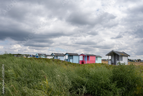Pastel-colored beach huts at Skanor beach, Scania county, south of Sweden.  © Dan