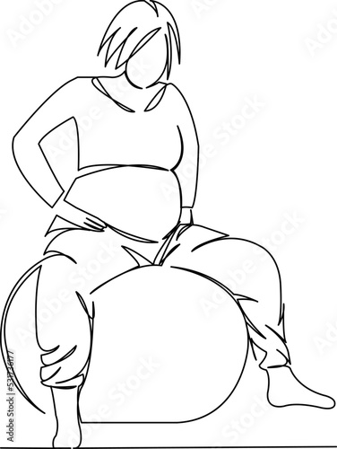 pregnant woman sitting on a big ball gymnastics childbirth