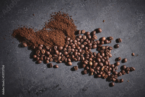 Roasted coffee beans on gray background