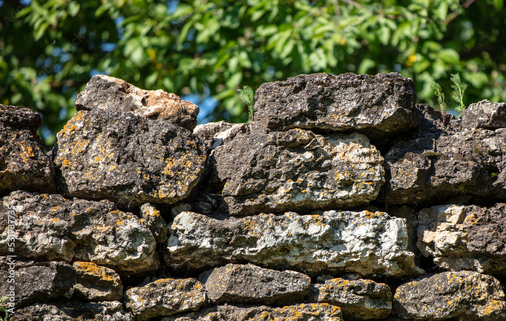 Wall of stone bricks on the fence.
