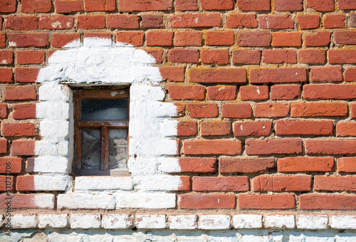 Windows on an old brick house.