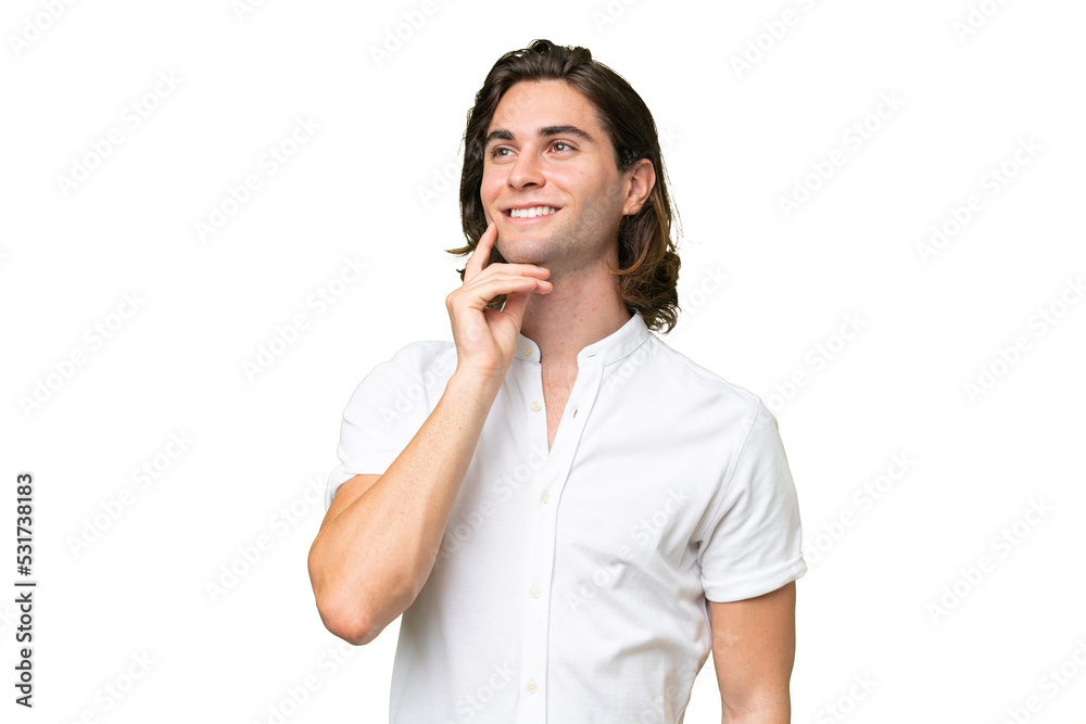Young caucasian man thinking an idea while looking up Young caucasian man thinking an idea while looking up