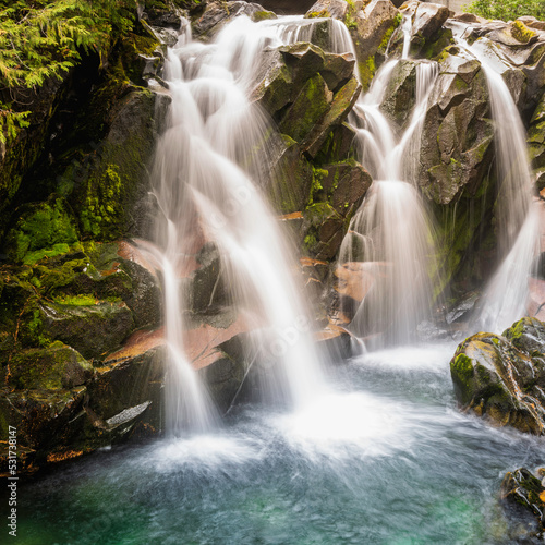 Cascade waterfalls on Paradise Rd in Mount Rainier National Park  Washington State. Long Exposure Photography.