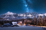 The Milky Way over the Tatras. Winter, mountain panorama, night. Poland, Zgorzelisko Clearing. Droga mleczna nad Tatrami. Zima, panorama gór, noc. Polska. Polana Zgorzelisko. 