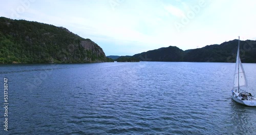 Sailing ship floating near Jørpeland city in Norway the panorama of fjord bay photo