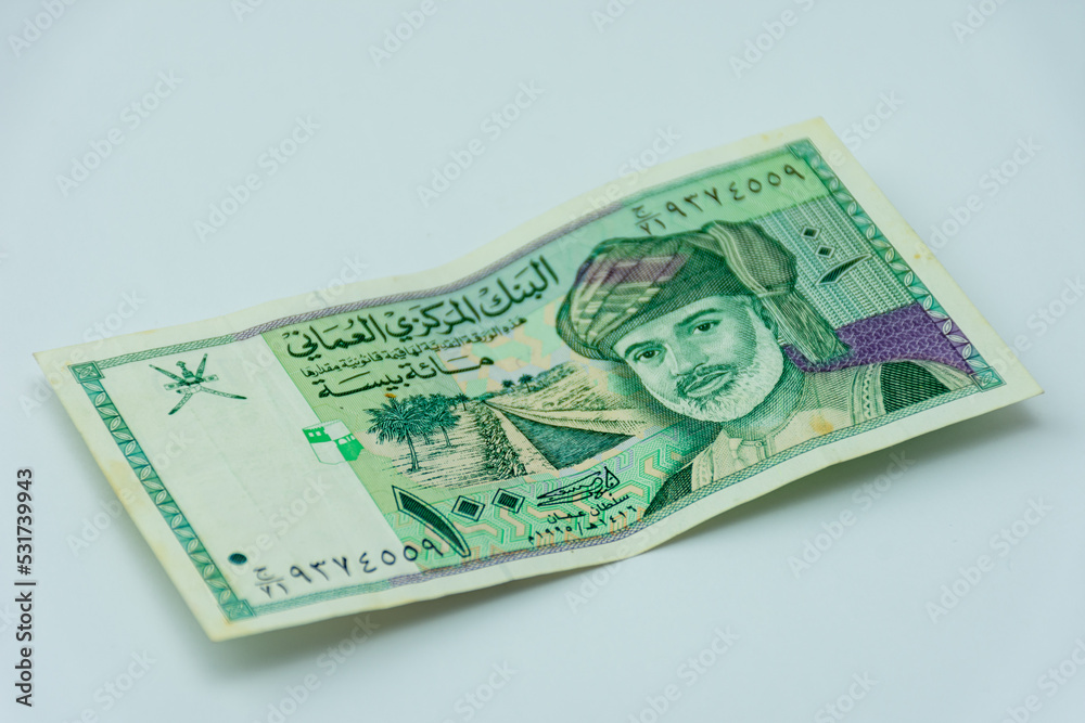 Oman riyal banknote on a white background. Selective focus. Stock Photo ...