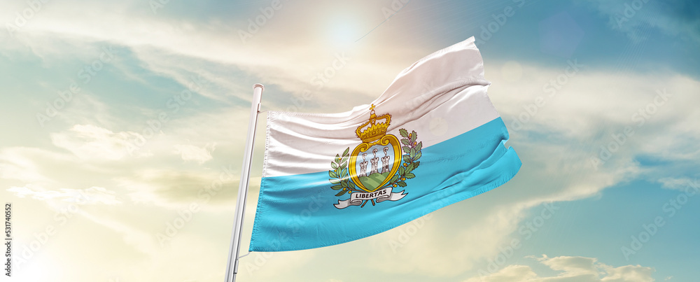 San Marino national flag cloth fabric waving on the sky - Image