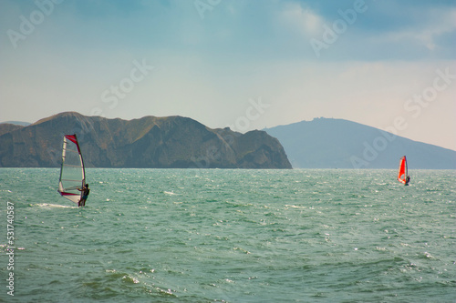 skiing windsurfing in the ocean waves © Oleg Zhukov