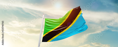 Tanzania national flag cloth fabric waving on the sky - Image photo