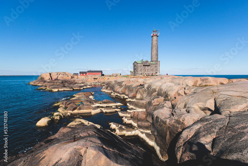 Bengtskär Lighthouse, summer view of Bengtskar island in Archipelago Sea, Finland, Kimitoön, Gulf of Finland sunny day photo