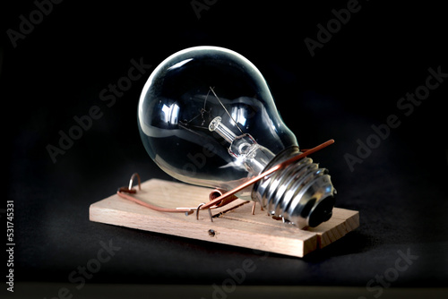  light bulb in wooden mousetrap photo