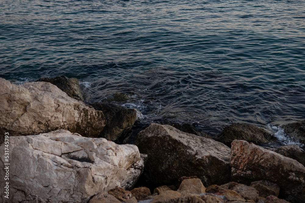 waves on the beach at sunset. rocks and sea. waves on the beach at sunset. rocks and sea.