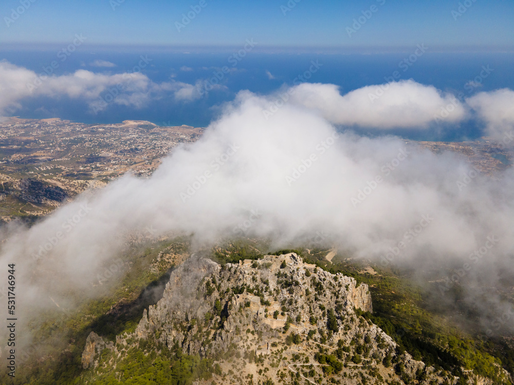 Obraz premium Beautiful natural landscape, aerial view of Cyprus mountains and blue sky with clouds, Mediterranean sea. Buffavento Castle. Nature background.