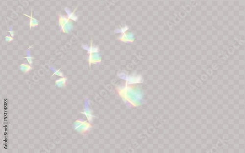 Rainbow highlights on a black background.Glare or reflection from water and glass.Glittering particles for social media backgrounds, product presentations, photo shots.