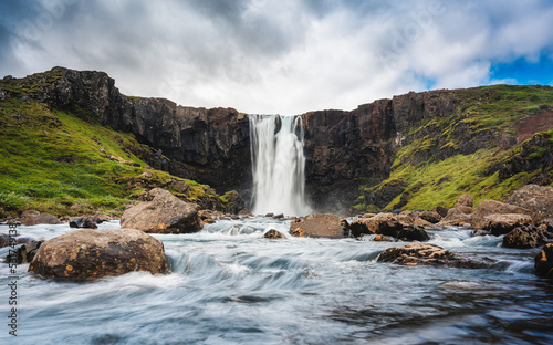 Gufufoss waterfall flowing thourgh rocks in summer at Seydisfjordur  East of Iceland