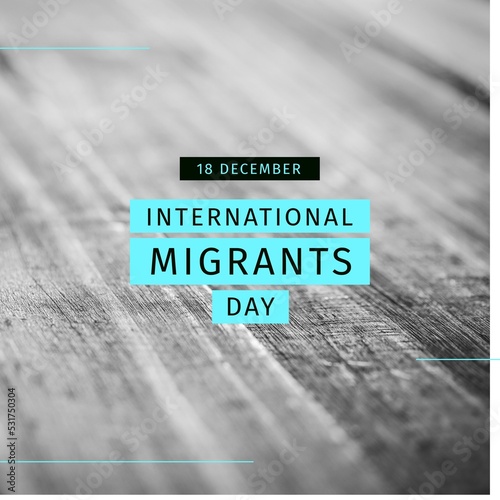 Composition of international migrants day text over black and white photo of wooden floor