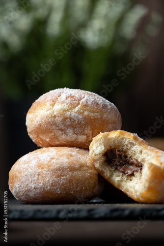 Sweet doughnut full of chocolate in low key