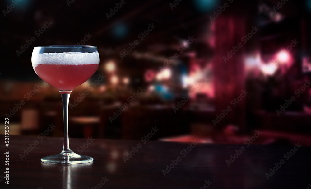Freshly prepared raspberry cocktail on a restaurant bar counter