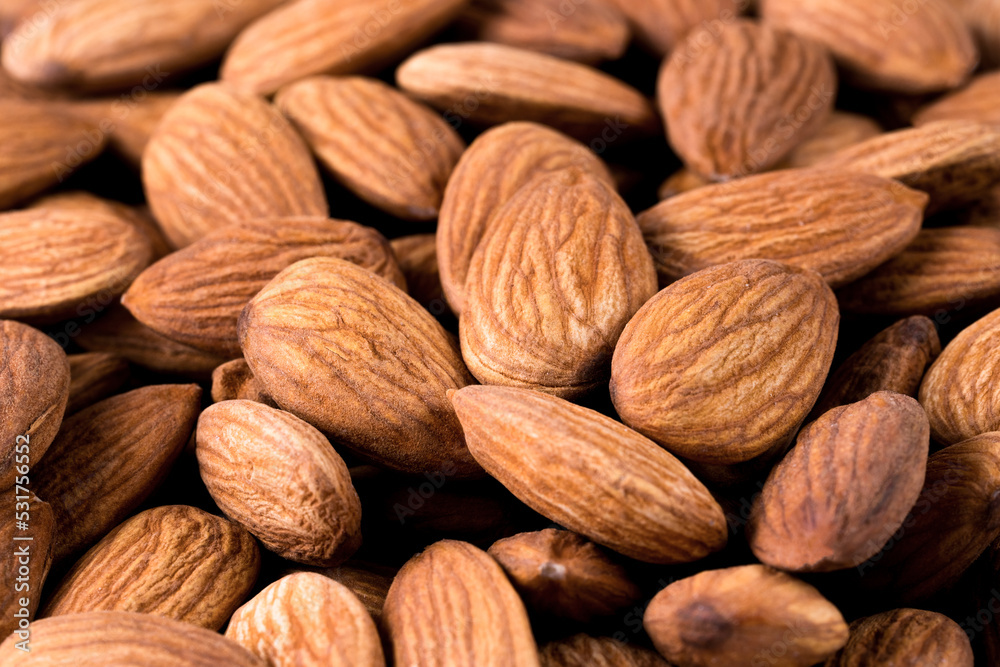 Texture of almond nuts. Symbol of natural healthy food Texture of almond nuts. Symbol of natural healthy food