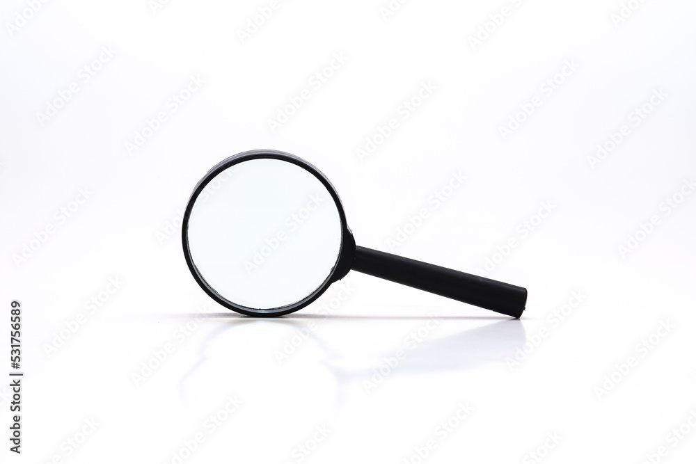 Loupe or magnifying glass on white. Shallow depth of field Loupe or magnifying glass on white. Shallow depth of field