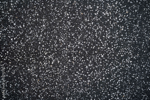 black terrazzo floor. Dark polished marble stone floor. Black chips of polished stone floor tile and wall tile design and ceramic