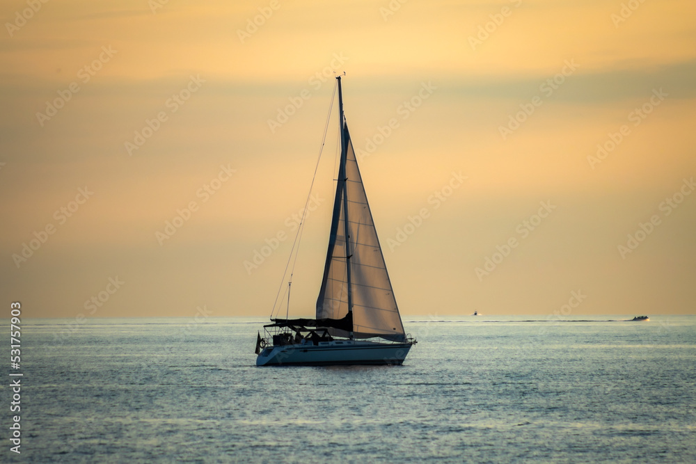 Sunset at Grand Bend Ontario as Boats Passes by Sunset at Grand Bend Ontario as Boats Passes by