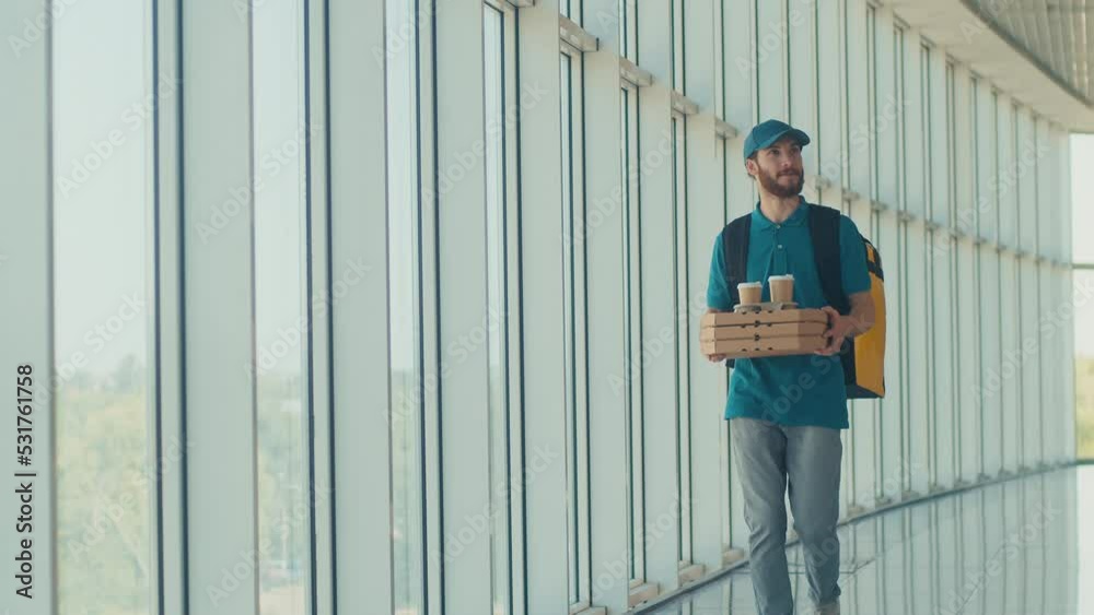 custom made wallpaper toronto digitalHandsome Delivery Man With Thermal Backpack Brings Pizza Boxes, Coffee to Modern Office Building. Deliveryman Worker Deliver Online Order Client. Courier on the Way to Deliver Order to a Client