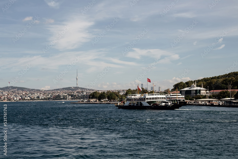 View of a car ferry boat on Golden Horn part of Bosphorus in Istanbul. It is a sunny summer day.