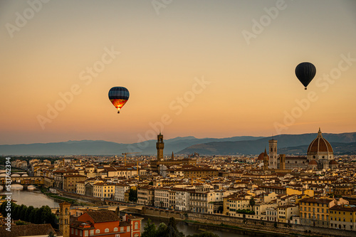 A hot balloon at sunrise over Florence