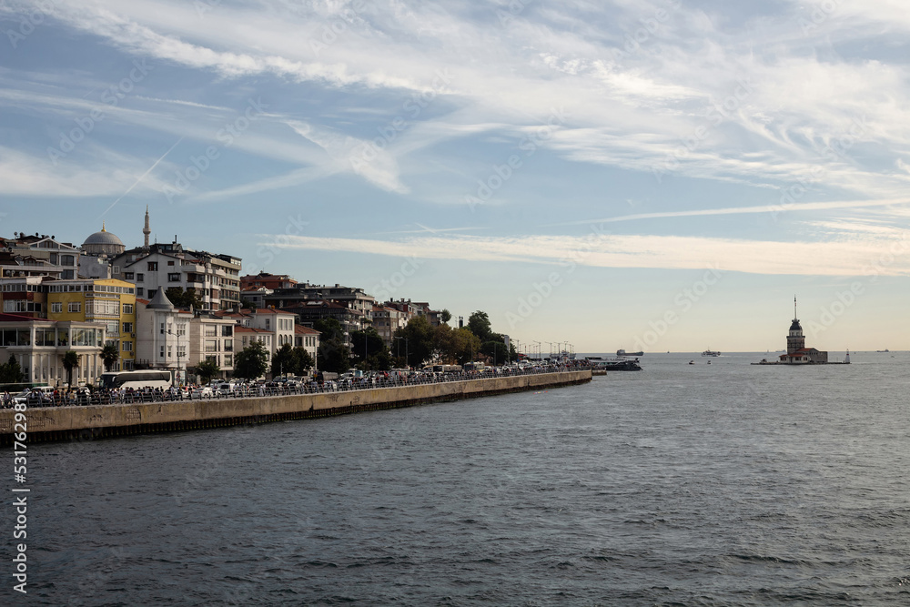 Fototapeta premium View of historical landmark called Maiden Tower and Uskudar area on Asian side of Istanbul. It is a sunny summer day. Beautiful scene.