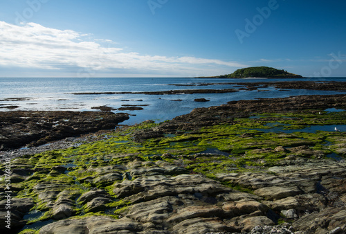 Sumer views from the Cornish holiday Seaside Town of Looe. View over the Beach and Island