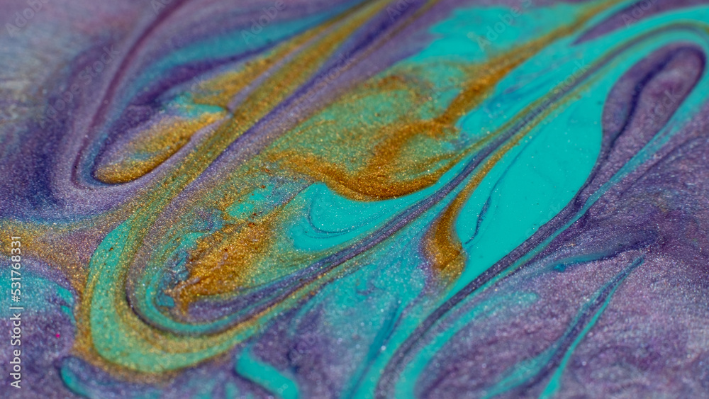 Colorful mix. Fluid art. Creative painting. Cyan blue purple gold glittered stream of liquid paint floating