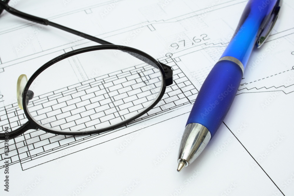 pen and glasses on the architectural plan pen and glasses on the architectural plan