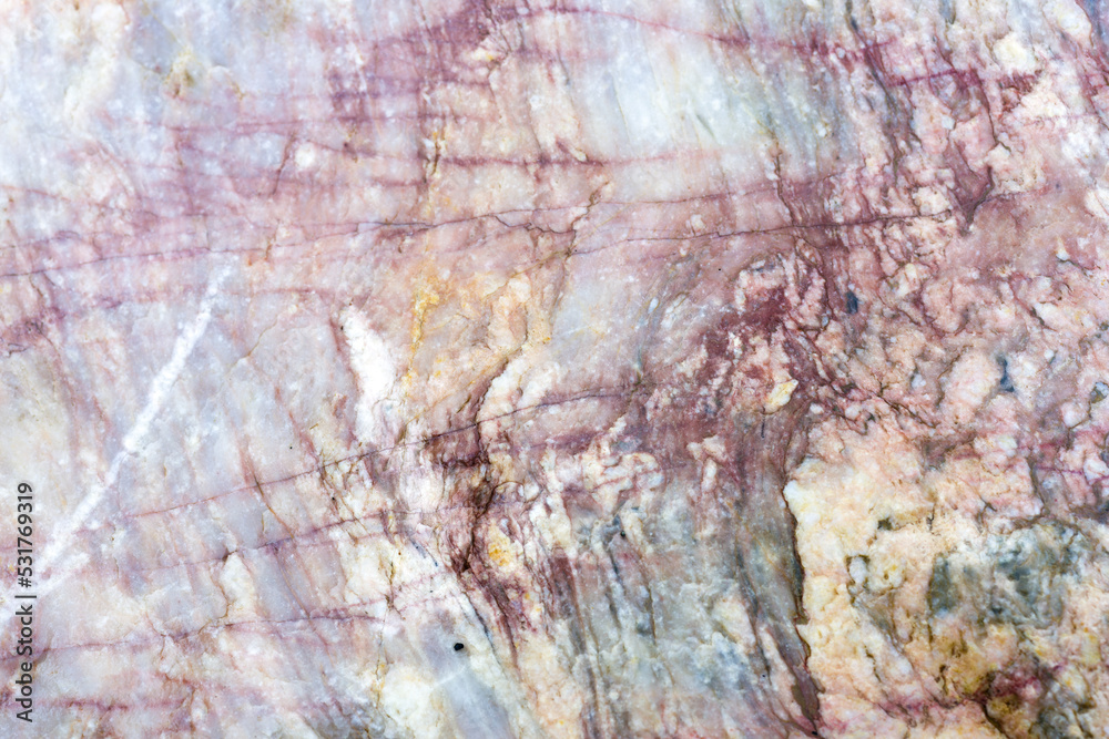 Naklejka premium Natural stone marble rock surface by the stream. Stone marble texture background.Selective focus.