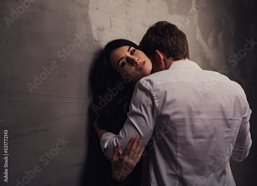 Sexy natural couple portrait. Man sexual toching and embracing his sensual beautiful girlfriend neck with much emotion. Closeup toned photo