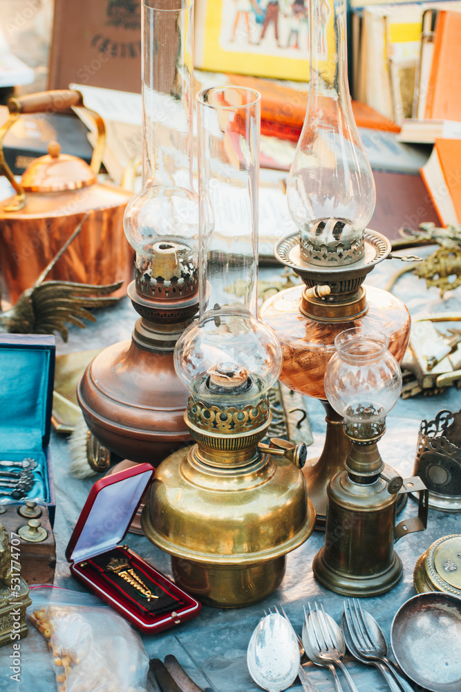 Antique kerosene lamps are sold at flea markets