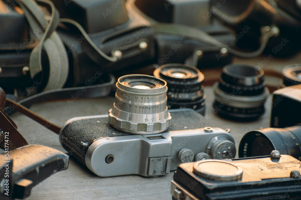 old photo and video equipment. vintage lenses. The flea market sells old cameras, camcorders