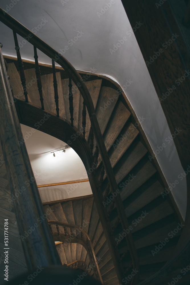 Fototapeta premium round staircase of an unusual, interesting shape in an old house