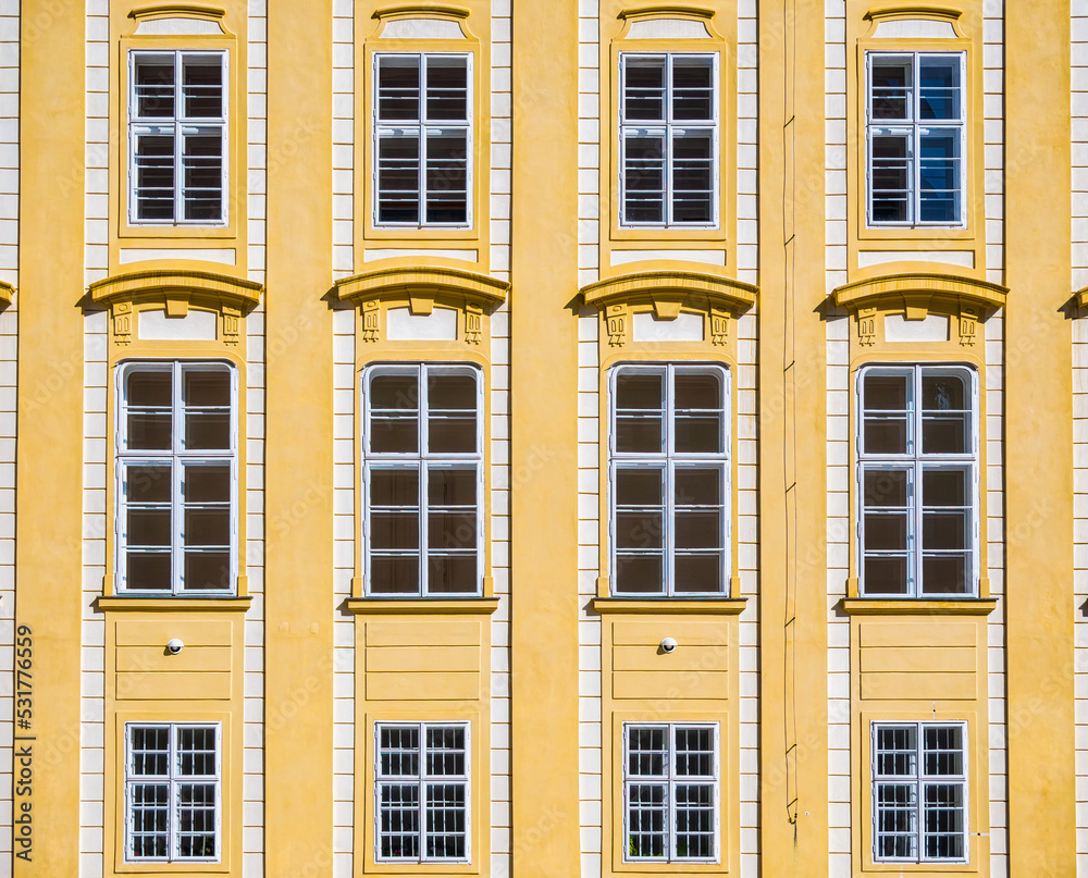 Architectural detail with the windows of an old building. Old vintage architecture in the center of Prague, Czech Republic. Seamless pattern background