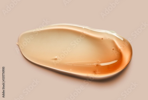 Liquid gel cosmetic smudge pink orange texture retro style gray background © tatyanarow