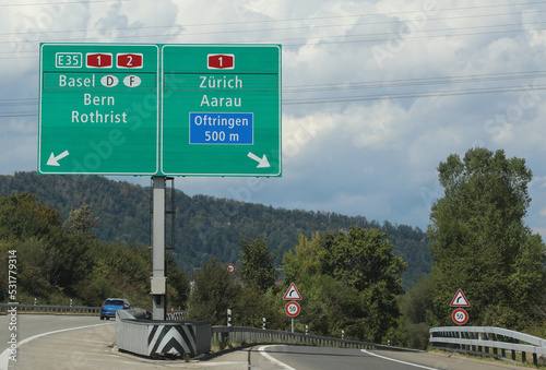 road sign of the Swiss highway with directions to reach European cities photo