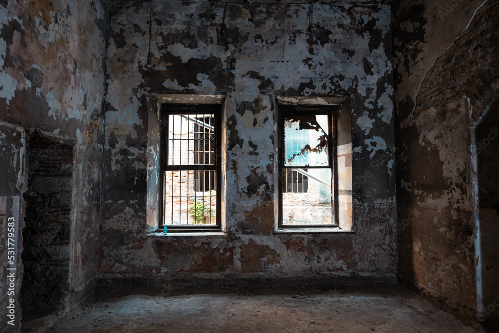 Abandoned building. Broken Windows and peeled walls of an historical building Abandoned building. Broken Windows and peeled walls of an historical building