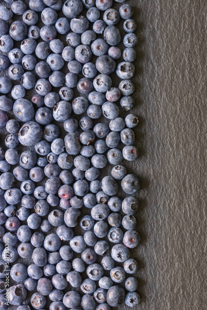 Fresh ripe whortleberries on black table. Copy space Fresh ripe whortleberries on black table. Copy space