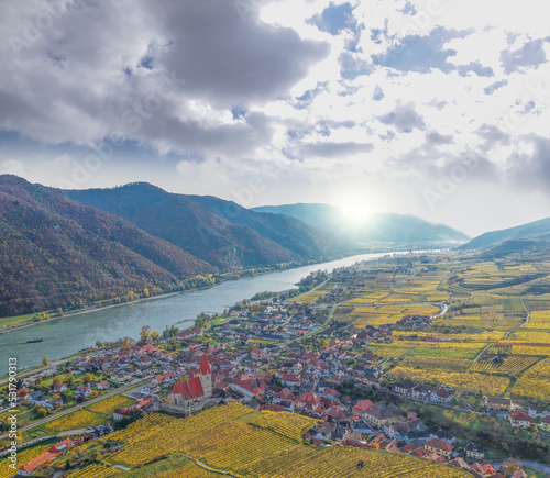 Photography Weissenkirchen village with autumn vineyards against Danube river in Wachau vall