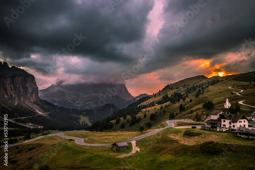 A fiery sunset on the Gardena Pass in the Dolomites