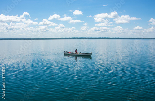 Canoeing on beautiful Lake Peten Itza, El Remate, Petén, Guatemala