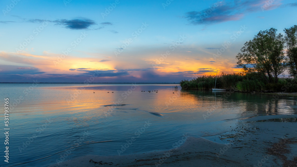 Obraz premium Beautiful sunset over lake Balaton of Hungary